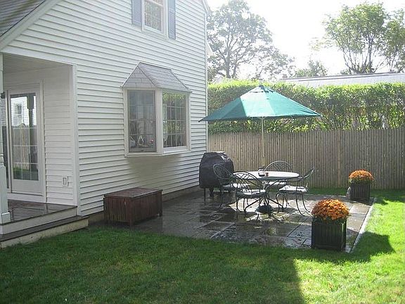 Bluestone patio with fenced backyard