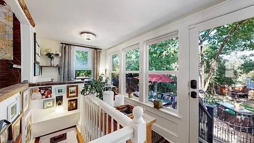 Beautiful bright back porch for an office with a view of the yard.