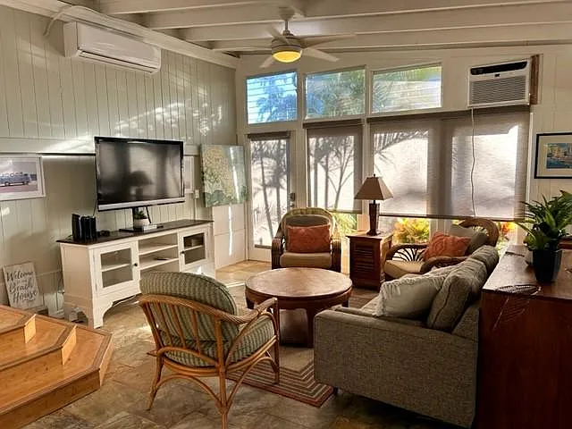 TV area with door to garden and AC