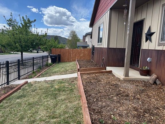 Front of Home with raised garden beds