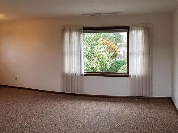 Enjoy the natural light and greenery pouring in from the large bay window.