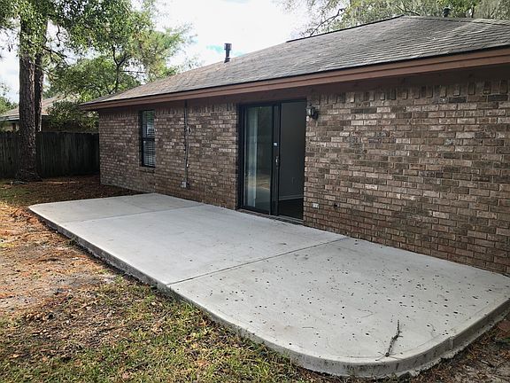 Back patio in fenced back yard