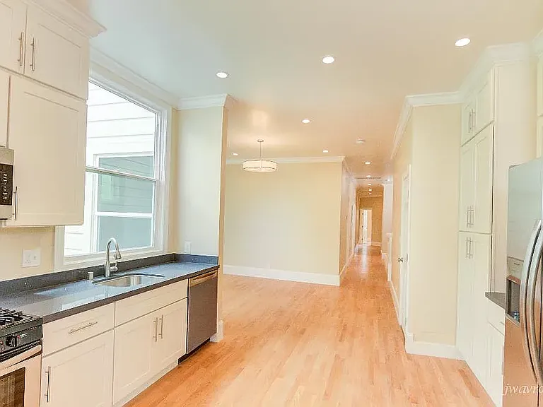 view of kitchen and living room from dining area