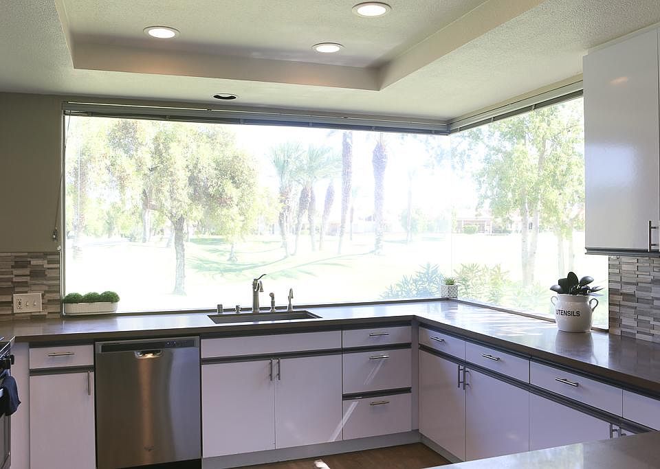 Remodeled kitchen with new stainless steel appliances and granite counter tops throughout