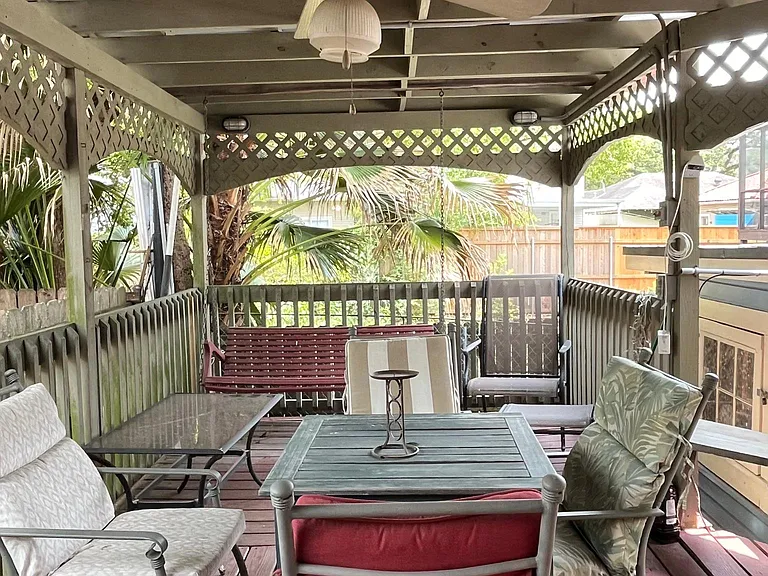Adjacente covered deck with ceiling fan.