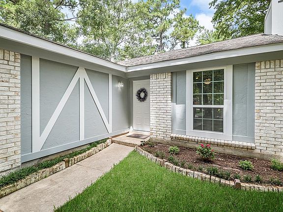 FRONT WALK to the home with NEW PAINT and NEW DOUBLE-PANED LOW "E" WINDOWS