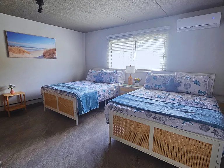 Light-filled room with artwork and air conditioning