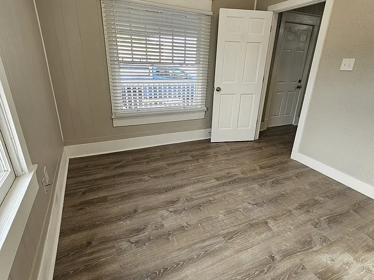 Front Bedroom 11' 6" x 10' with ceiling fan.