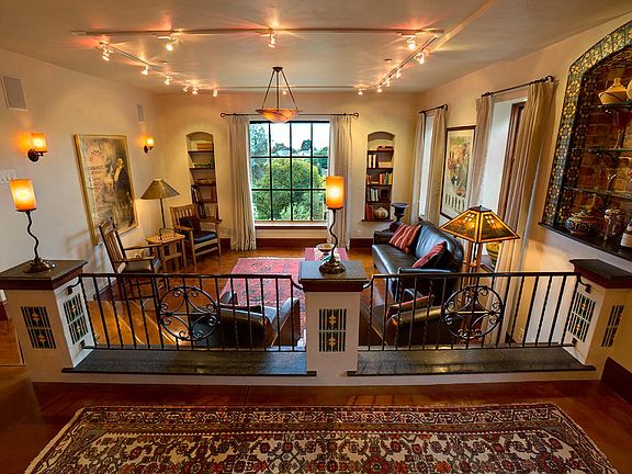 View into sunken living room from kitchen. Bay and Mt. Tam view from picture window.