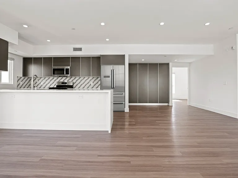 Open-Concept Floor Plan with Recessed Lighting, Built-In Cabinets, and Vinyl Flooring