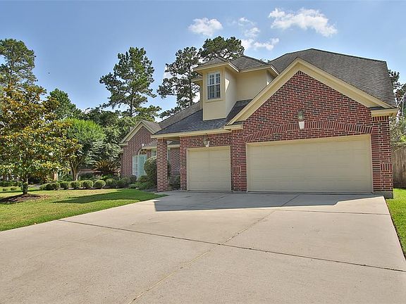 THREE CAR GARAGE WITH TRIPLE WIDE DRIVEWAY.