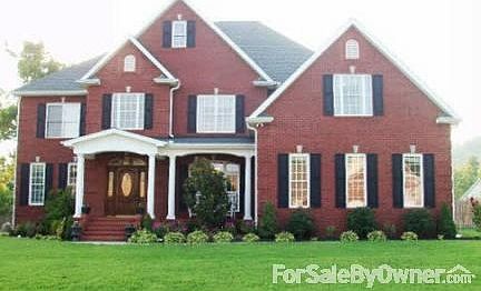 Front view of house
						:
						Mahogany wooden door. Nice corner lot.