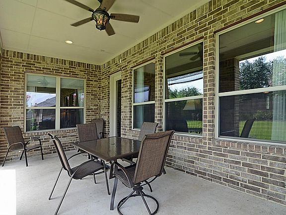 The back Porch is ample in size and is an ideal spot for conversation, to watch a colorful afternoon