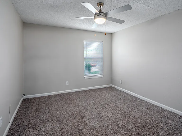Bedroom with carpet & ceiling fan