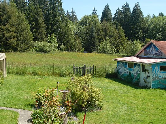 Adjacent parcel included. 