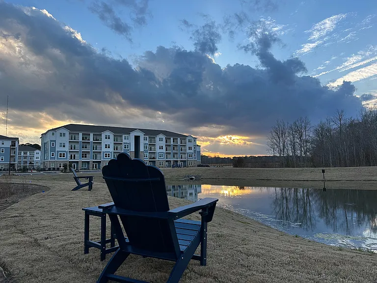 Experience tranquility at our lakeside apartments, where stunning sunsets meet peaceful living.