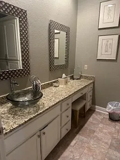 Bathroom has granite countertops, plenty of under cabinet storage, very large linen cabinet and separate closet.