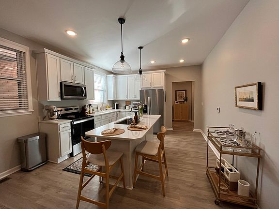 Kitchen with custom cabinets and quartz counters