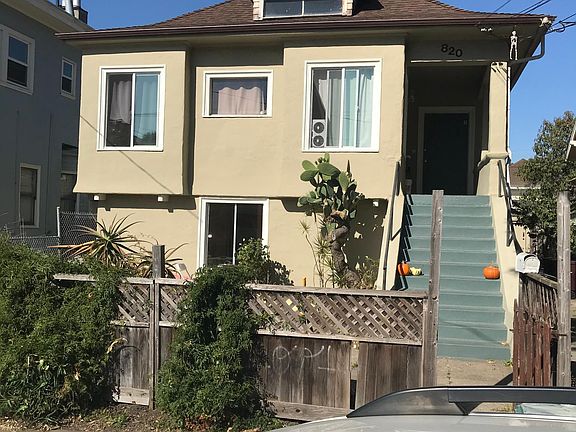 Front view of property. The unit is in the lower front portion of the building