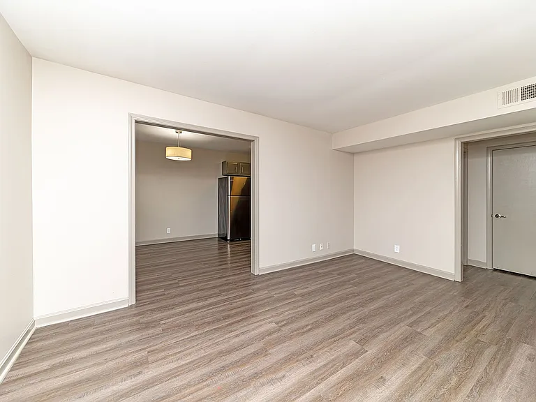 Bedroom with hardwood-style flooring