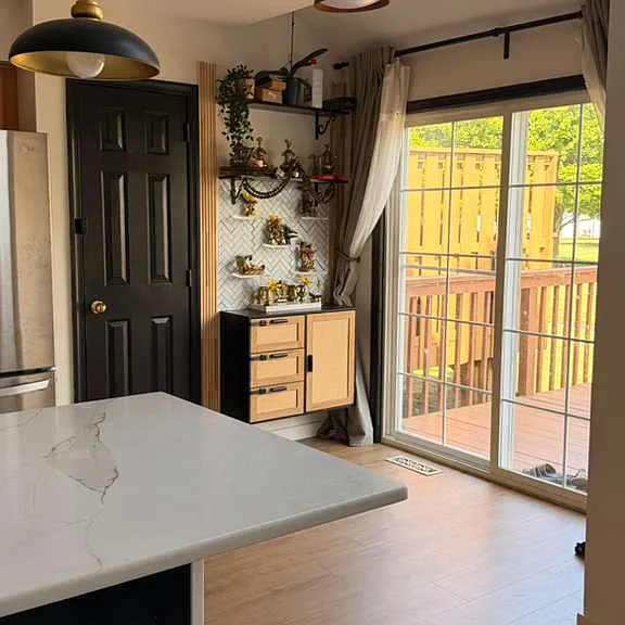 KITCHEN PANTRY AND SLIDING DOOR TOWARDS DECK