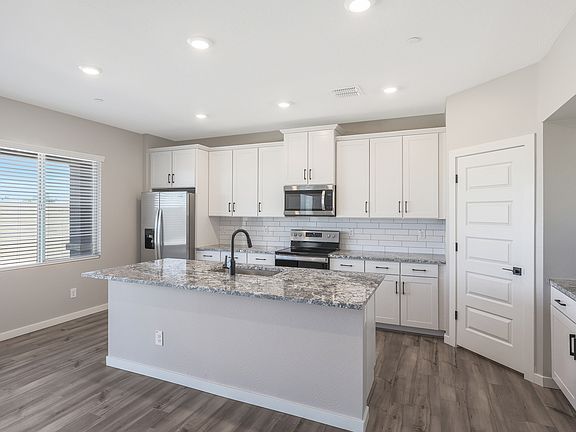 The kitchen serves as the perfect spot for making memories through cooking.