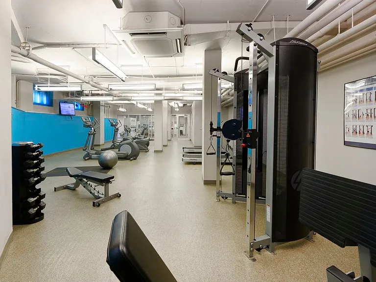 Fitness center with strength equipment and flat screen televisions