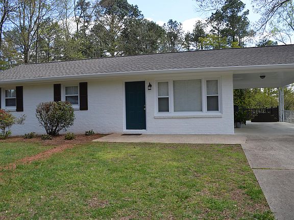 Welcome to your new home! This house has both a carport and a drive-under garage (on the left side.)