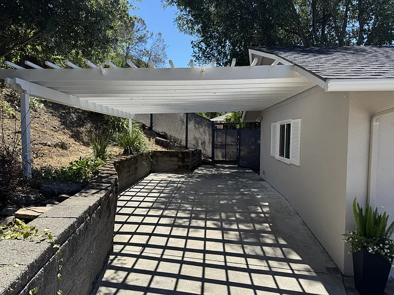 Arbor over a carport or, project, art, hobby area.