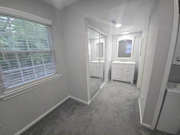 Here is a view of the vanity and on the left is the sliding doors for the closet. I put recessed lighting in so you can see. I did not put up towel bars or anything bath accessories yet. I have them not installed yet.