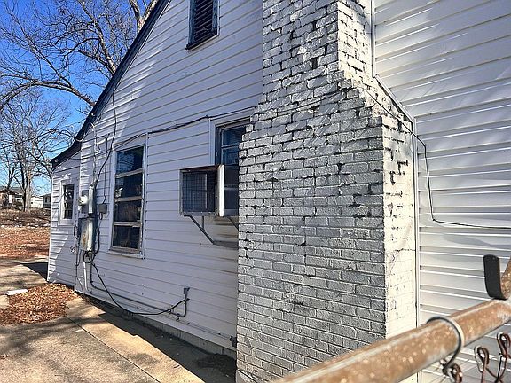 Left side of house.