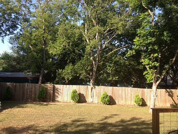 large backyard with amazing deck and huge trees