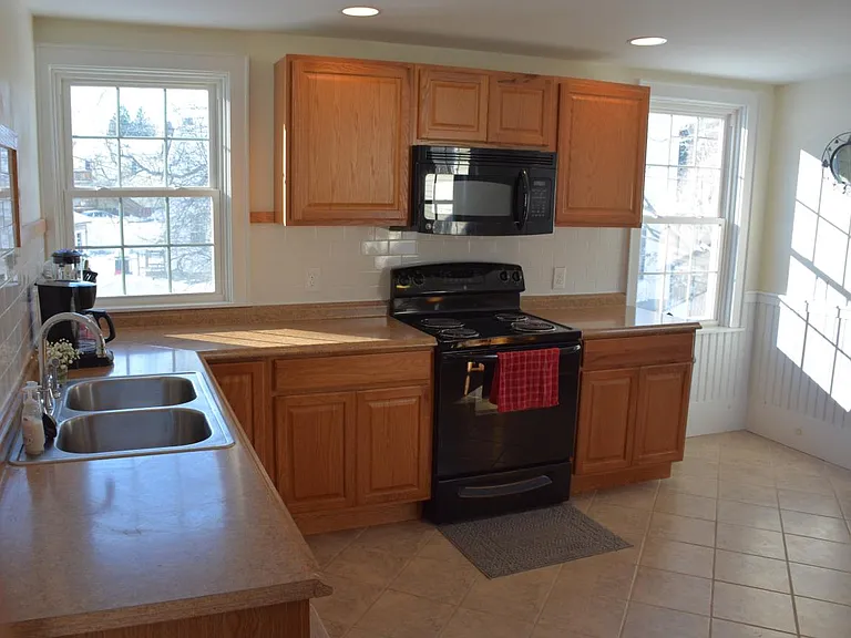 New Kitchen - Large Windows and Beadboard on walls