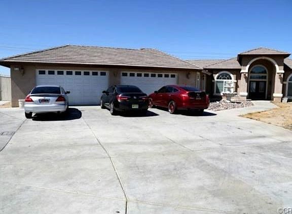 Four Car Attached Garage with Direct Entry to House. Plenty of