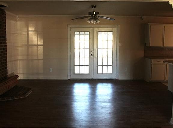 LARGE BREAKFAST AREA WITH FRENCH DOORS LEADING OUT TO COVERED BACK PATIO AREA