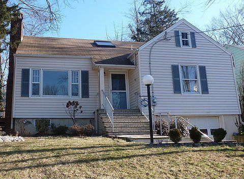 22 Sycamore Ave is a 3BR/2Bth expanded Cape Cod w/low maint. vinyl siding.