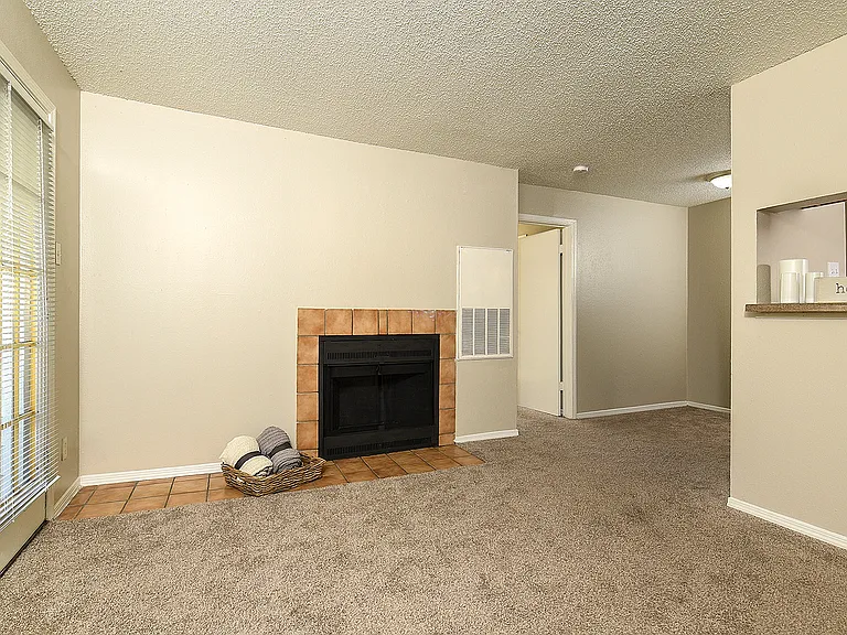 Classic One Bedroom Living Area with Fireplace and French Doors