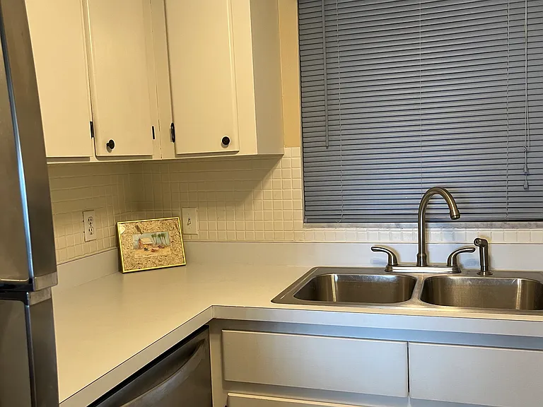 New stainless refrigerator and dishwasher. Also has disposal.