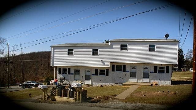 Front of building. Unit D is on left end