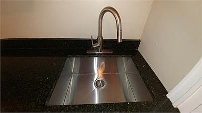 Under-Mount Sink & High End Faucet along with the gorgeous granite counter-tops!