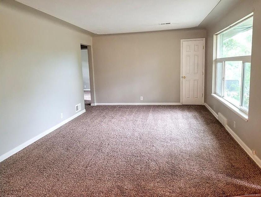 living room with new windows, new carpet, and new paint