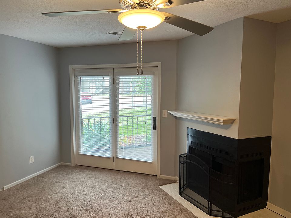 Living room with access to screened-in, covered porch