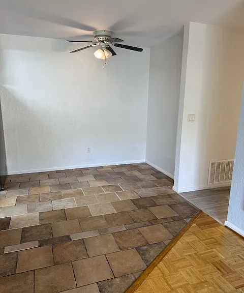 dining room with stone tiles
