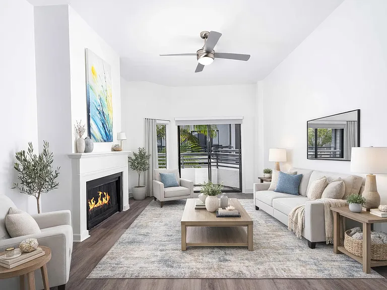 Featuring bright living rooms with cozy fireplaces in select homes, high ceilings, and access to a private balcony.
