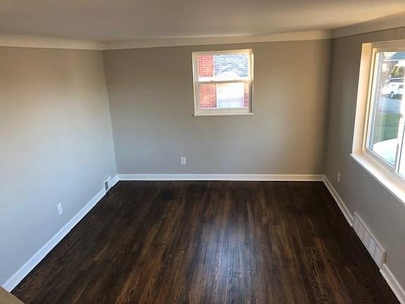 Beautiful refinished hardwood floors in the living room.