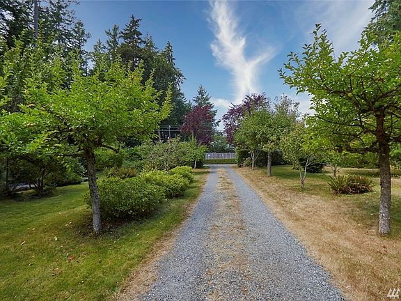 Tree Lined Driveway Past Bocce Ball Court; Fruit Trees; And Garden Space. This Over 1 Acre (1.09; Two Tax Parcels) Awaits You & Yours.
