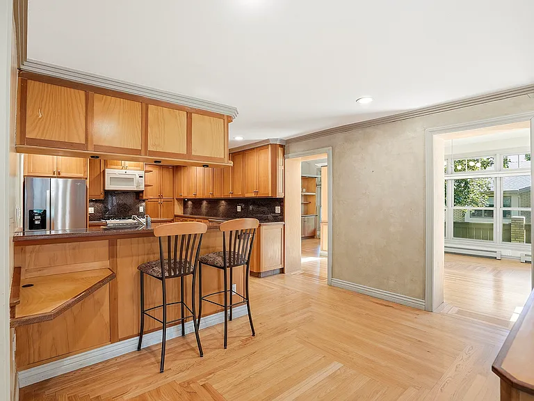 Whether enjoying morning coffee or helping with dinner prep, the breakfast bar creates a natural place to gather while staying connected to the heart of the home.