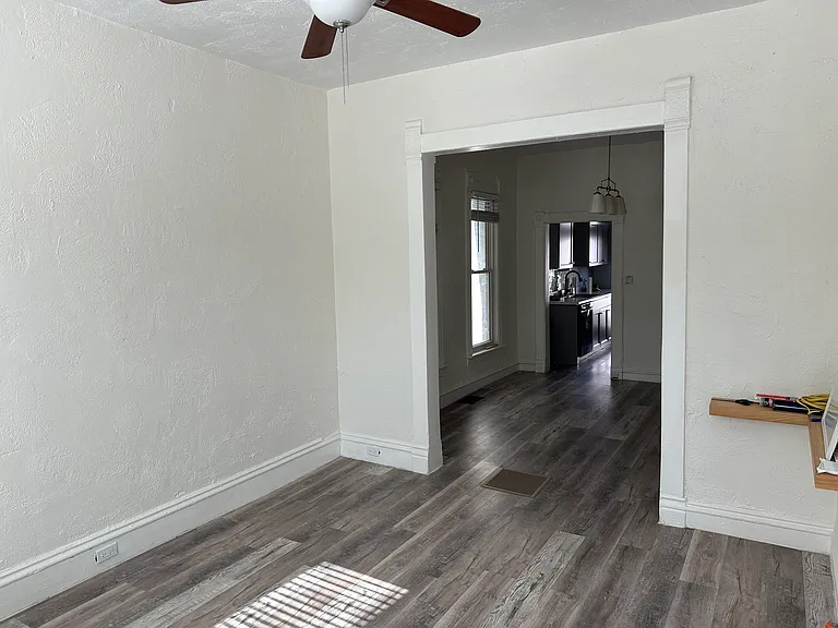 Living room looking at dining room and kitchen entry