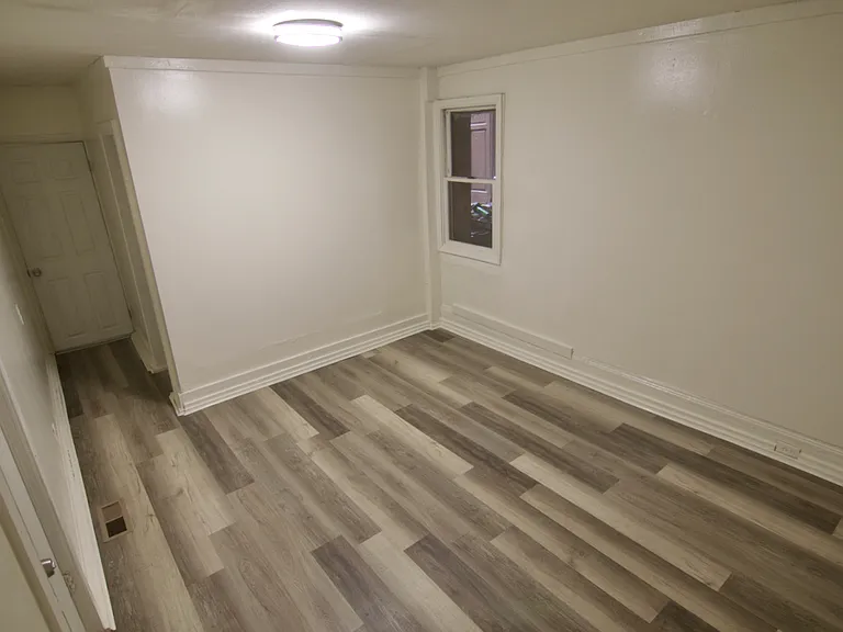 Bedroom 2 closet and hallway that leads to the Bathroom and Kitchen