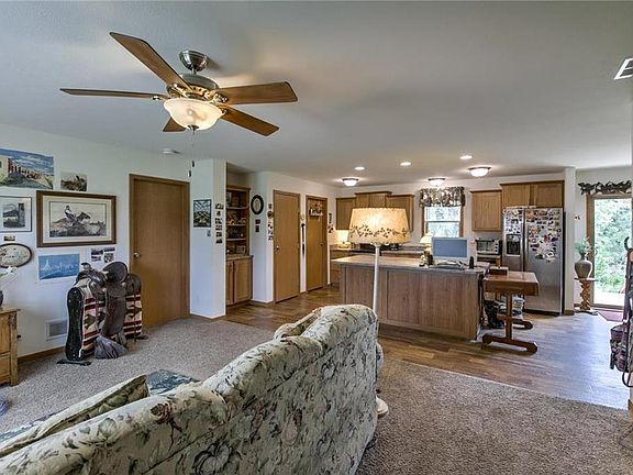View of living room and kitchen from front door.